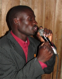 Pastor Maiko Msyani Tunduma seen here leading Praise and Worship at Mbeya, he has a beautiful voice and uses it to worship God.