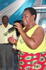 Bishop's wife leading the demo PowerClub at the end of their Tanzania KIMI Leadership training 