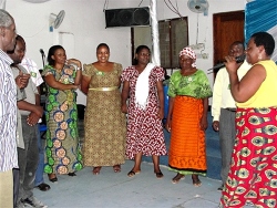 Bishop's wife leading the demo PowerClub at the end of their Tanzania KIMI Leadership training 