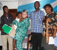 Seen here Jenny with a little friend and to her left Pastor David and Suma (far right) one of the teachers that we are believing God will work with us to get the KIMI programme into the schools of Tanzania.