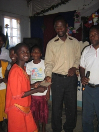 Bishop David with the children of the Kisses From Heaven PowerClub.