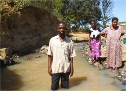 House of Prayer and Freedom Church,Mbeya, Tanzania - Senior Pastor Bishop David Akondowe baptising new members praise God.