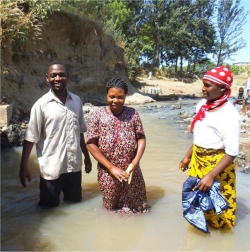 House of Prayer and Freedom Church,Mbeya, Tanzania - Senior Pastor Bishop David Akondowe baptising new members praise God.