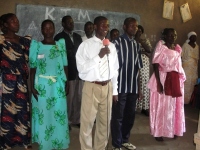 Seen here with his leaders in the CEPCI church in Bugiri.