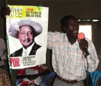 Patrick seen here teaching about 'Praying for our Leaders' using a visual aid of the President of Uganda. 