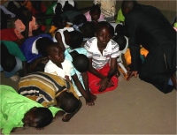 Pastor Abraham on his follow up visit to Bugire is seen here taking the children into the Holy of Holies. 