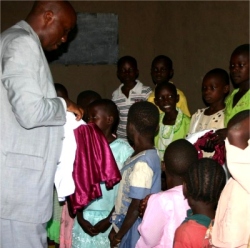 Bishop Pinos visited The King's PowerClub and was able to bless them with white T-shirts and burgundy shorts. 