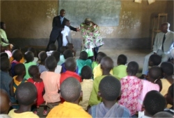 Pastor Abraham giving a KIMI PowerClub demonstration as part of the follow up programme organized by the KIMI Co ordinator