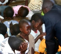 Pastor Abraham on his follow up visit to Bugire is seen here taking the children into the Holy of Holies. 