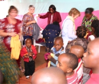 Clothes had been donated by Trevor Clarke from Winifred Trophies and these where distributed to the Hope Children's Choir as part of their uniform.