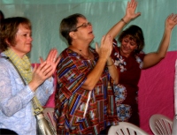 Seen here with the KIMI team Pastor Laura and Liz in worship during their first week in Africa.