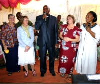 Jenny Tryhane, founder of UCT, Liz and Pastor Laura on either side of Bishop when the KIMI team worshiped at the church on the first sunday prior to the start of the KIMI Mission Trip 2011. 