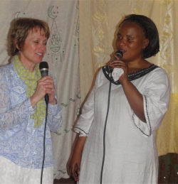 Pastor Martina in church translating for Liz,Pastor Laura's traveling partner, as she brought a greeting from her church and American family. 