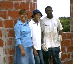 Pastor Happy, his lovely Barbadian wife and Evangelist Betty Clarke (left) during the recent visit to Carriacou