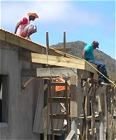 Pastor Happy on the roof help is needed to finance this project