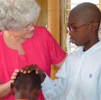 Children praying for other children