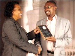 Dr Veronica Evelyn with Godwin Muhanguzi