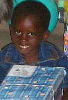 As the shoe boxes were distributed the children were photographed and documented to help establish the Suriname Child Sponsorship Program.