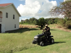 Seen here Pastor Abraham from Uganda on the ride on mower. 