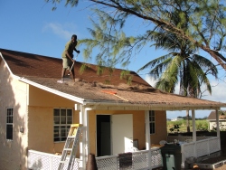 Seen here John cleaning the roof on Shalom Cottage, the old Blacksmith cottage.