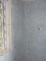 The bathrooms have been repainted and tiled in a beautiful blue mosaic tile. 