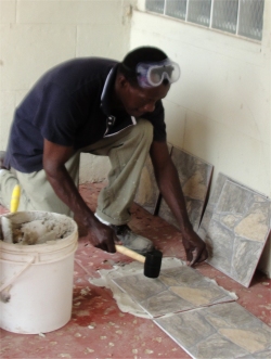 Pastor Alleyne, head of Evangelism, came with a tiling team from Farm Road United Pentecostal Church 
